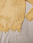 Suéter amarillo pastel