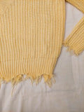 Suéter amarillo pastel